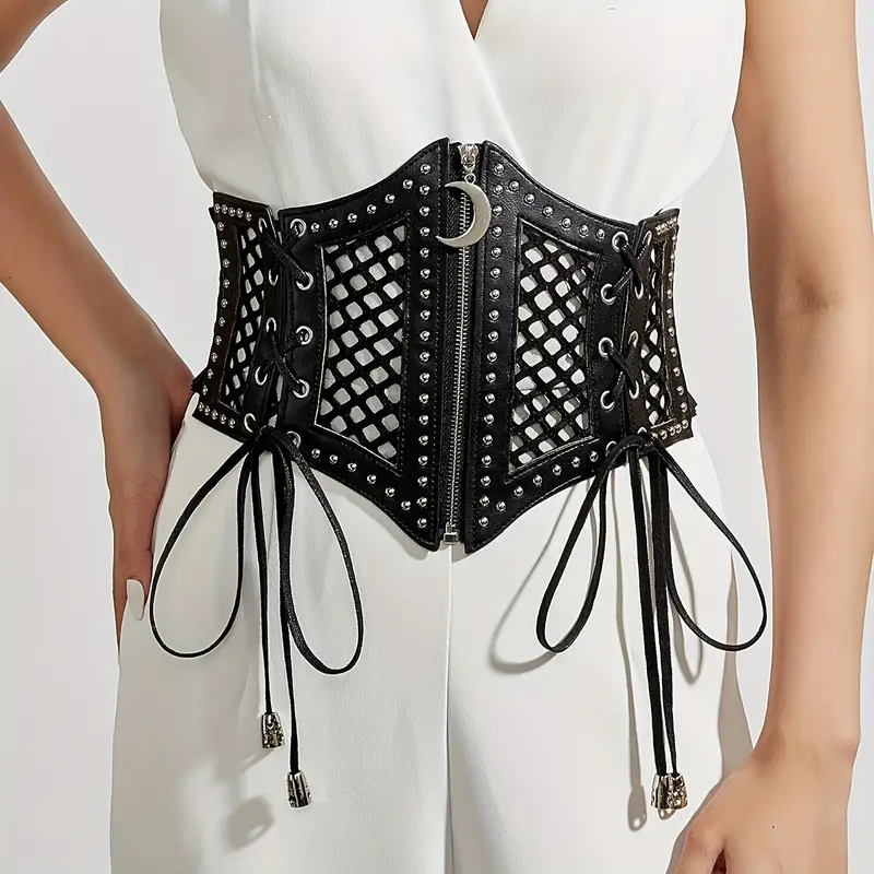Corset negro de malla con cierre frontal y detalle de luna sobre vestido blanco.
