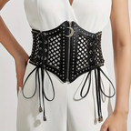 Corset negro de malla con cierre frontal y detalle de luna sobre vestido blanco.