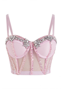 Corset rosa con transparencias y pedrería floral en el escote