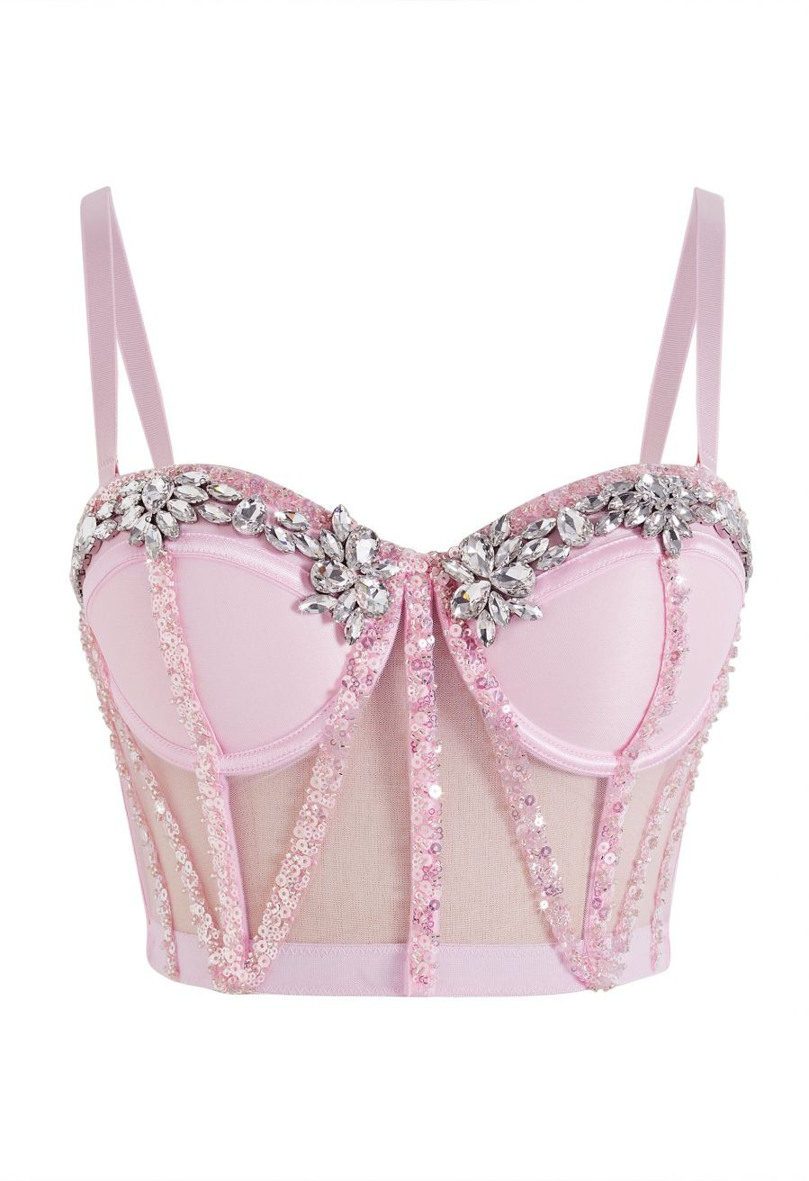 Corset rosa con transparencias y pedrería floral en el escote