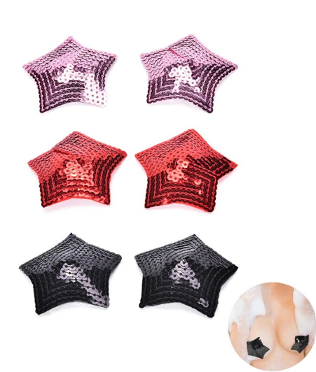 Pezoneras en forma de estrella con lentejuelas, mostradas en tonos lila, rojo y negro.